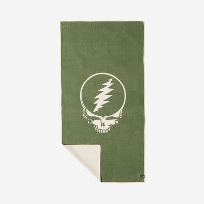 Quick-dry towel with graphic skull design, corner folded to display reverse side.