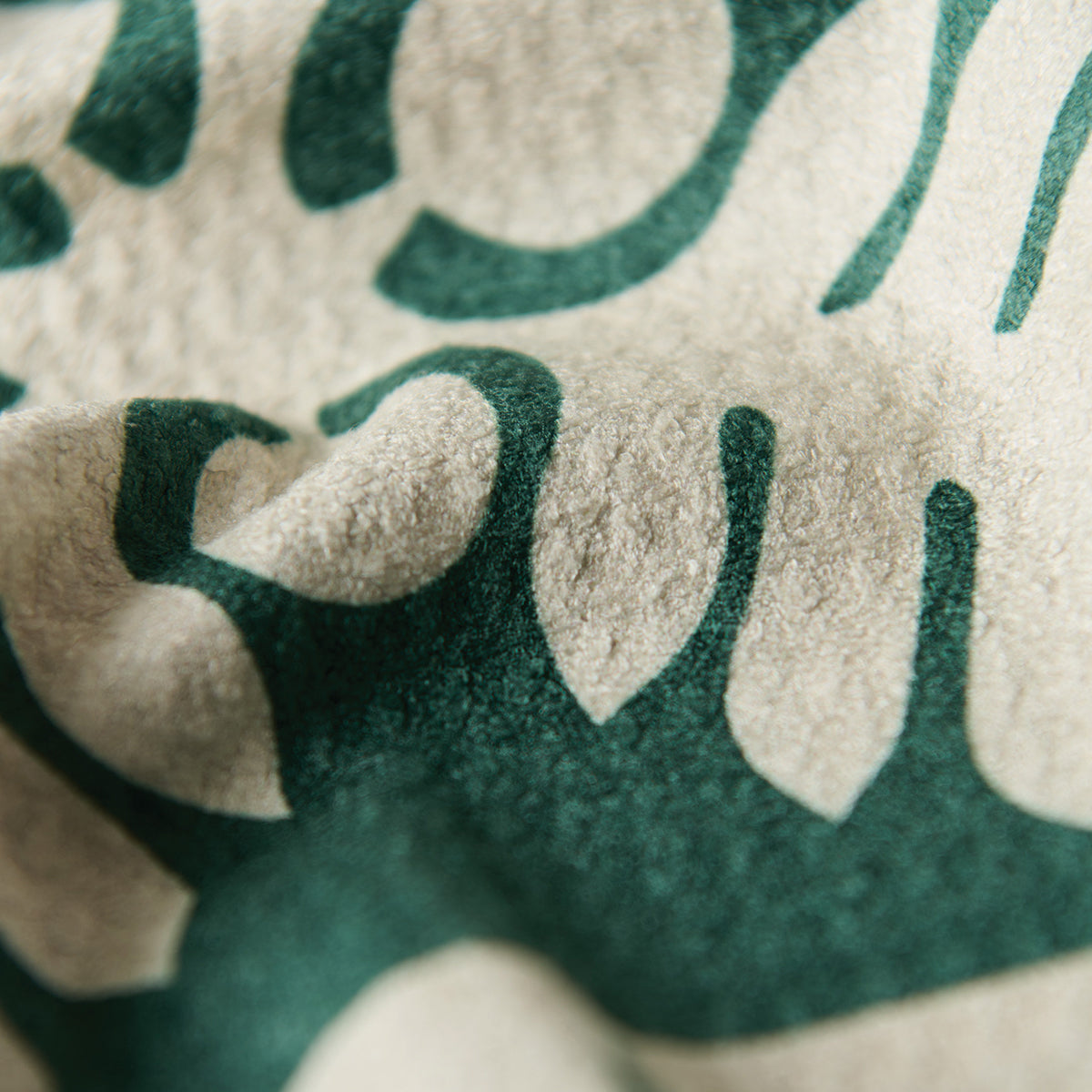 Kitchen towel, eco-friendly material, green and white pattern, soft texture.