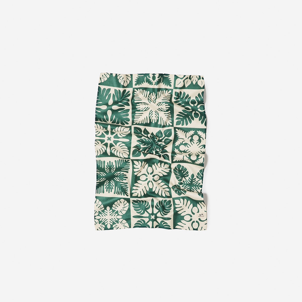 Microfiber kitchen towel with green and white floral leaf grid pattern.