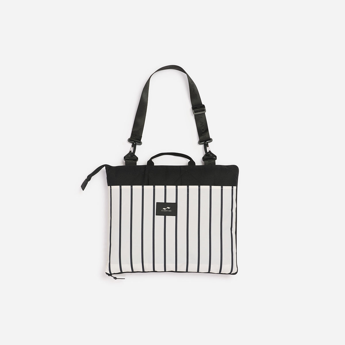 Foldable picnic blanket with black and white vertical stripes and a black top panel.