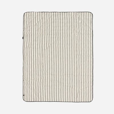 Quilted water-resistant picnic blanket with black pinstripes.