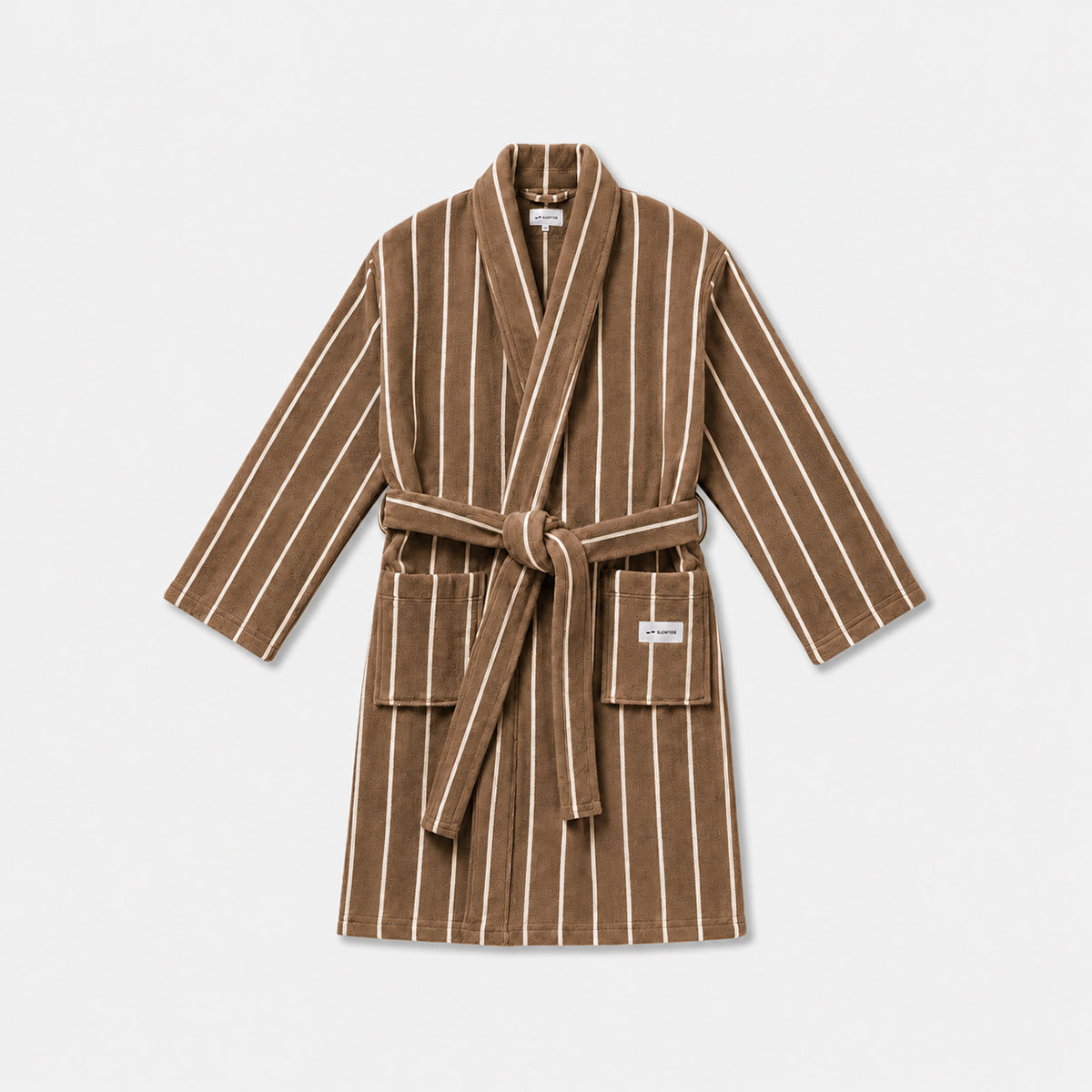 Striped bathrobe with brown and white pattern, two pockets, and belt laid flat.