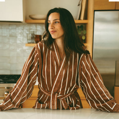 Plush bathrobe in brown and white stripes with tie waist.