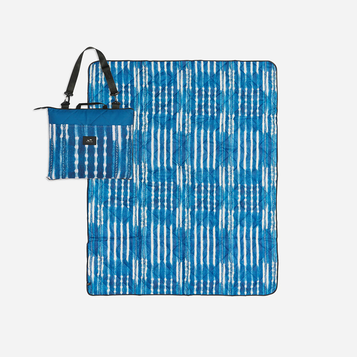 Outdoor blanket, blue and white, water-resistant with matching foldable carrying bag.
