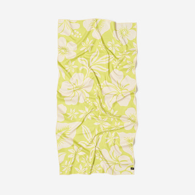 Quick-drying towel with white floral pattern, yellow-green, shown flat with slight wrinkles.