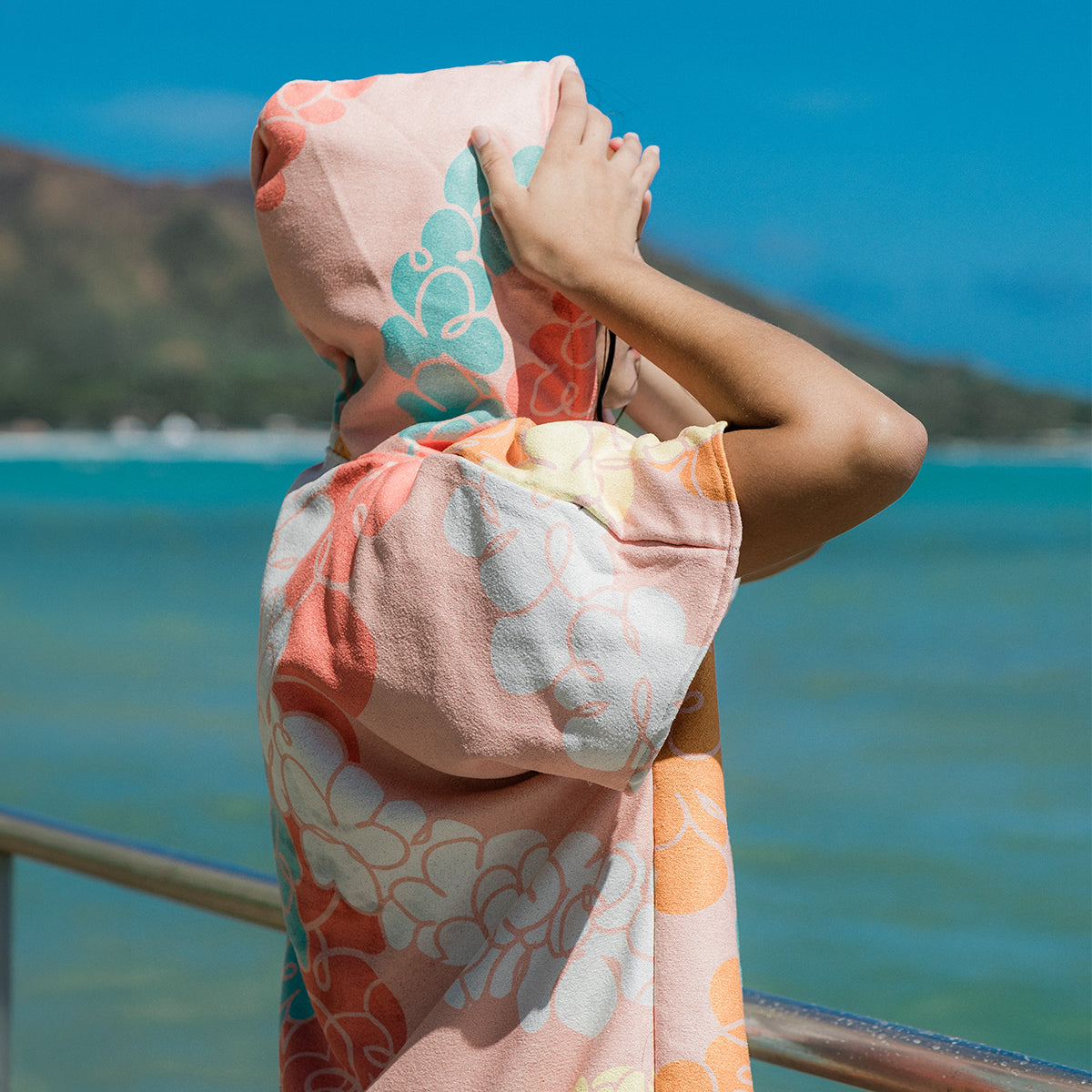 Floral hooded towel changing poncho, sustainable material, by the ocean and mountains.