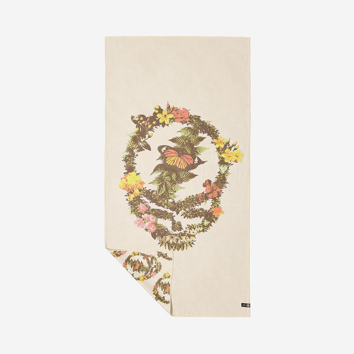 Beige quick-dry towel with floral and butterfly skull wreath design.