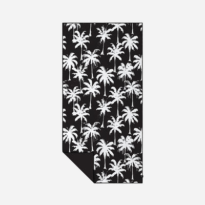 Black recycled towel with white palm tree pattern, quick-drying.