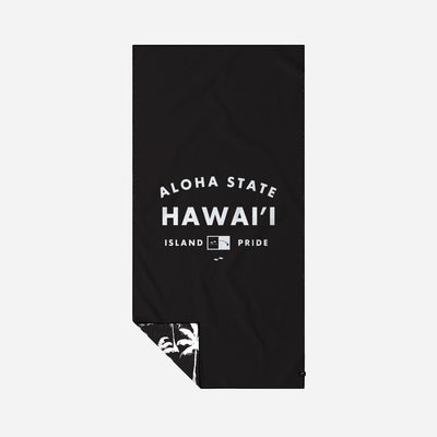 Black recycled towel with Hawaii Pride text and palm tree print on one corner.