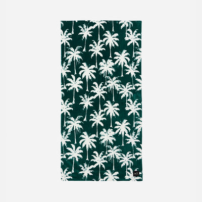 Beach towel in absorbent velour with a white palm tree pattern on dark green.