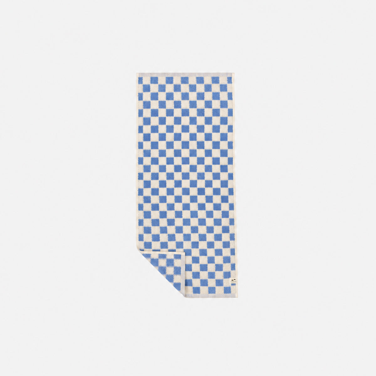 Hand towel with blue and white checkerboard weave on a white background.