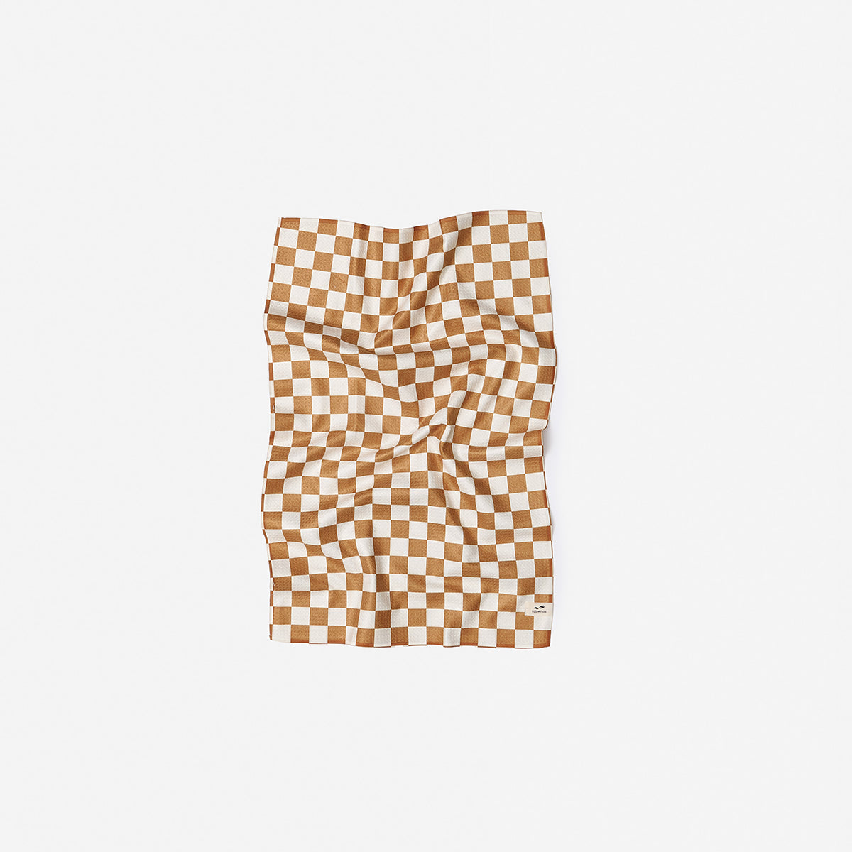 Quick dry towel with brown and white checkerboard pattern, shown on white surface.