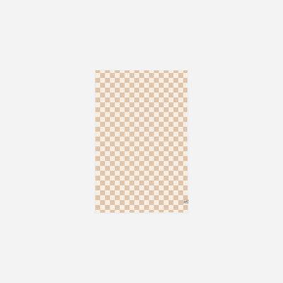 Throw blanket in recycled microfiber with a beige and cream checkerboard pattern.