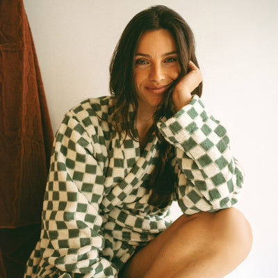 Terry cloth robe in a green and white checkerboard pattern.