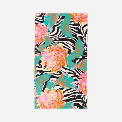 Velour towel with zebra stripes, tropical leaves, and pink-orange flower print.