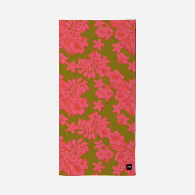 Beach towel with pink floral pattern on olive green background.