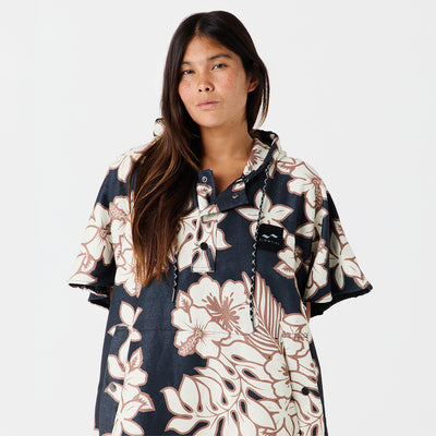 Floral print poncho with multicolor pattern on plain background.