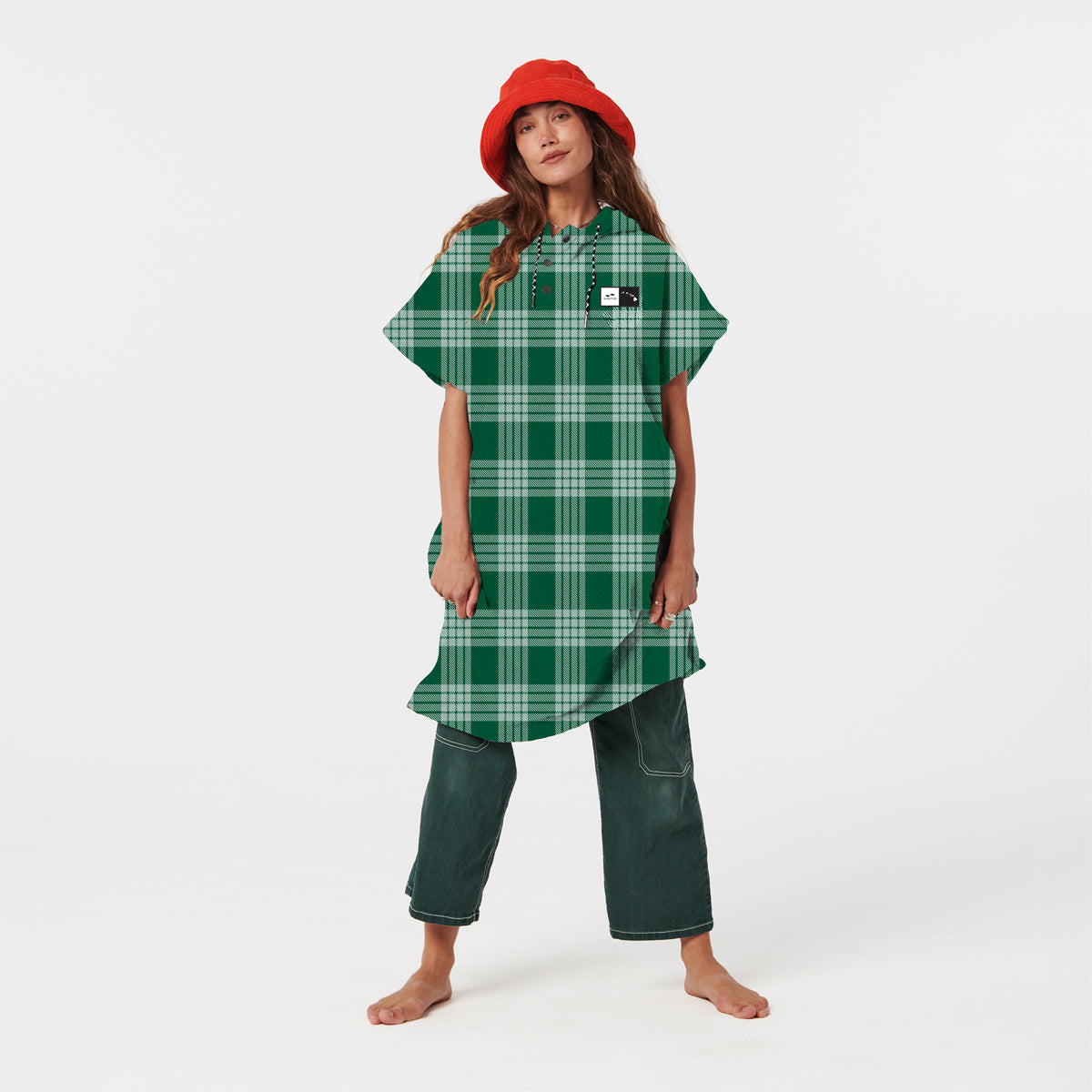 Green plaid recycled changing poncho and green pants with red hat.