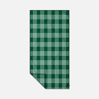 Plaid oversized towel with green and white pattern on white background.