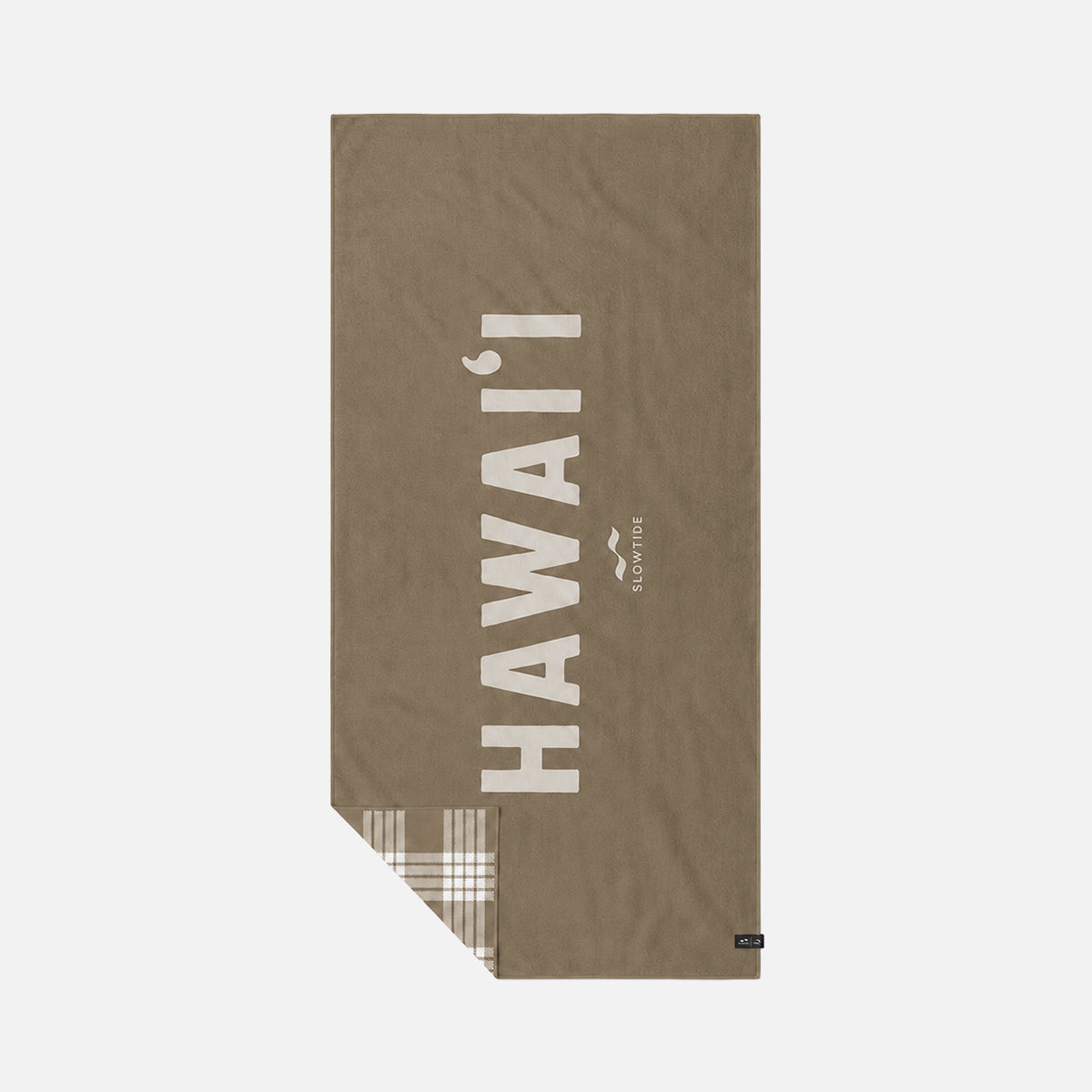 Brown quick-dry towel with white text and plaid corner accent.