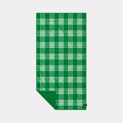 Quick-dry towel in green with a white palaka plaid pattern.
