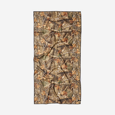 Woodland camo quick-dry towel with brown and green rectangle pattern.