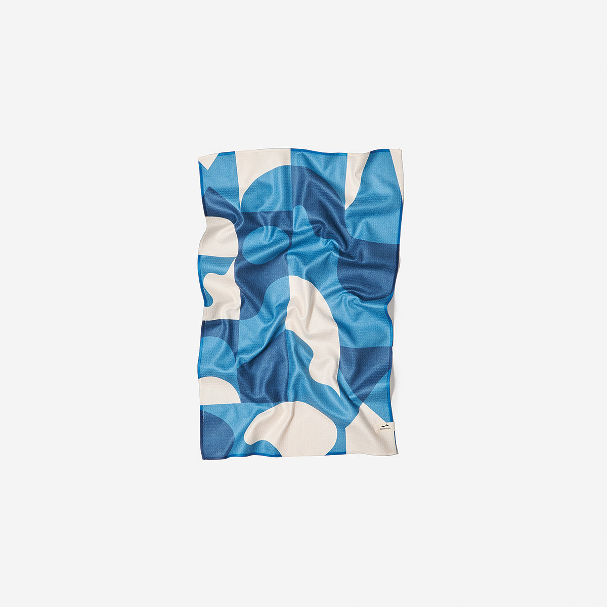 Kitchen towel with blue and white abstract geometric pattern.