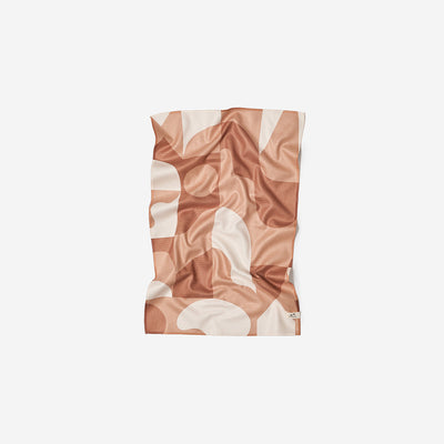 Recycled microfiber kitchen towel in a tan and white geometric pattern.