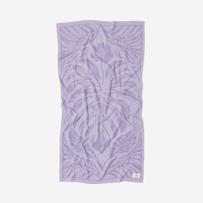 Light purple velour towel with textured leaf and floral pattern.