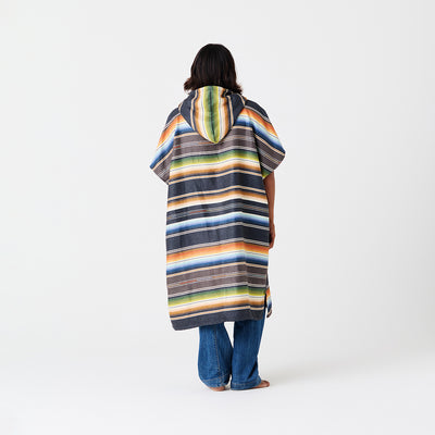 Striped quick-dry changing poncho with bold pattern, shown for surf or swimwear changing.