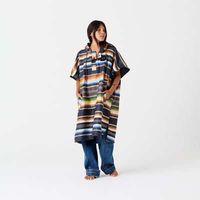 Striped quick-dry changing poncho, sand-resistant fabric, colorful pattern.