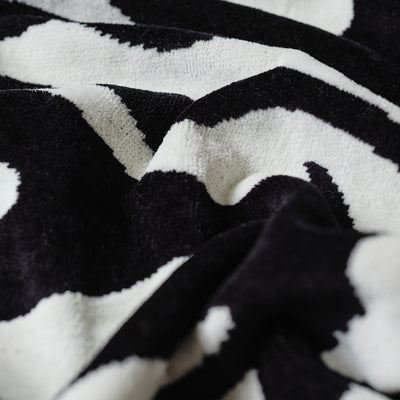 Zebra print tote bag in soft textured fabric with subtle folds.