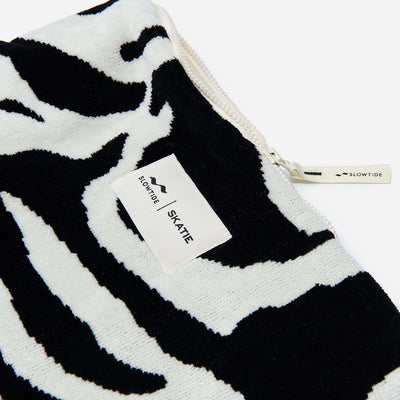 Terry pouch cotton canvas with black and white zebra print and zipper.
