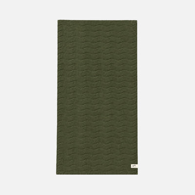 Olive green quilted cotton mat with subtle wave pattern, rectangular shape.