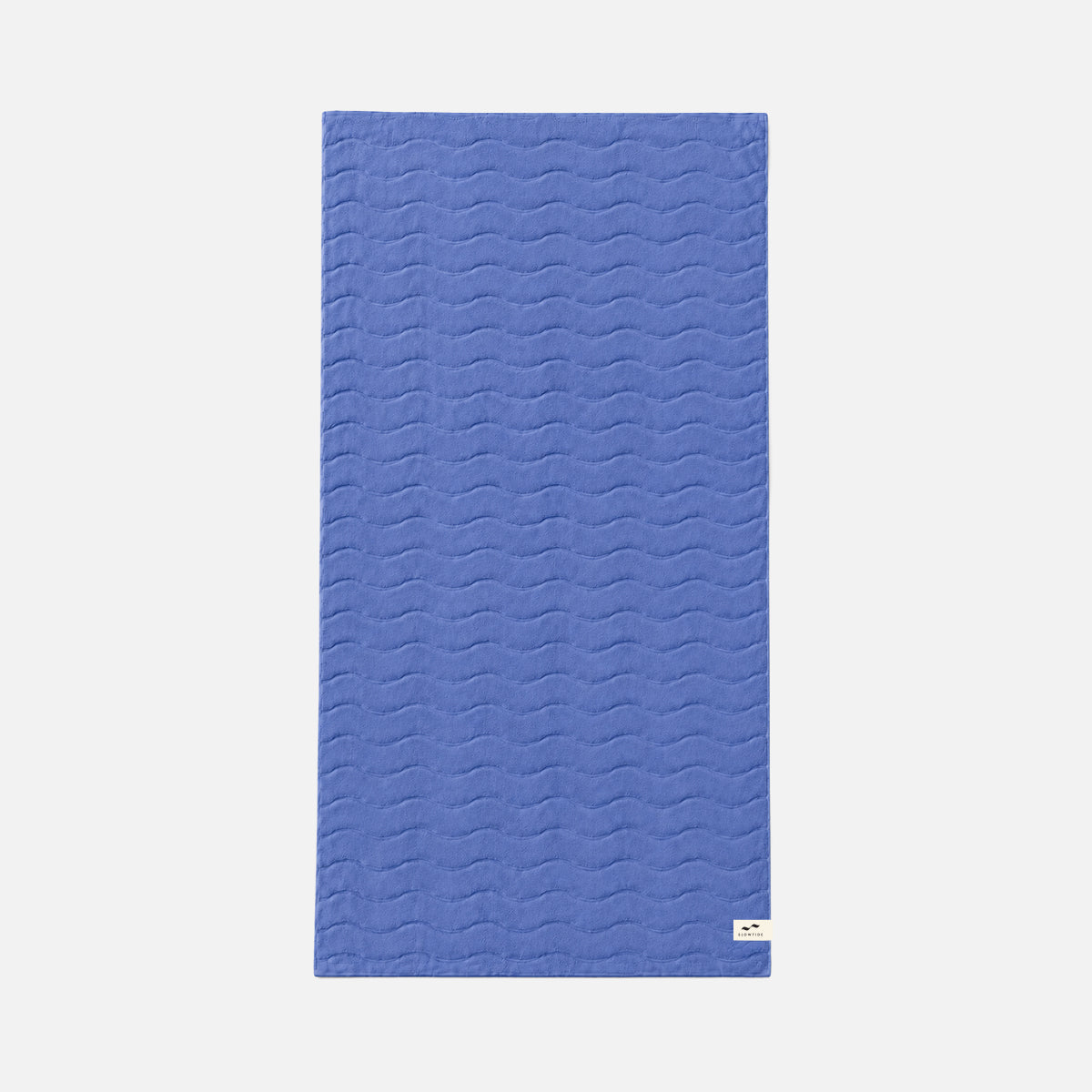 Cotton bath towel with plush texture and subtle wave pattern.