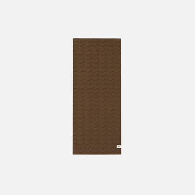 Brown plush cotton towel with subtle wavy pattern on white background.