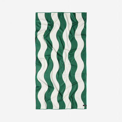 Lightweight towel with wavy green and white stripes on a white background.