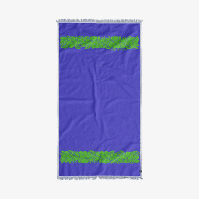 Turkish towel, sand-resistant cotton with green leaf pattern and fringed edges for beach use.
