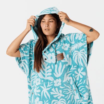 Towel poncho in blue floral cotton terry with hood.