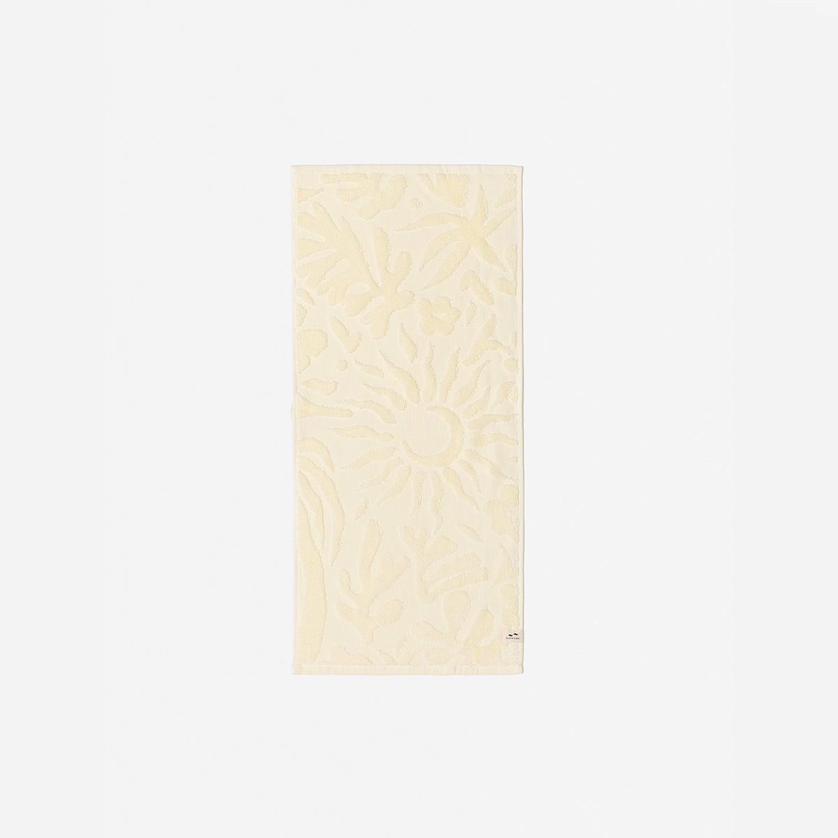 Cream cotton towel with sculpted floral and raised sun pattern, 550 GSM, for bath use.