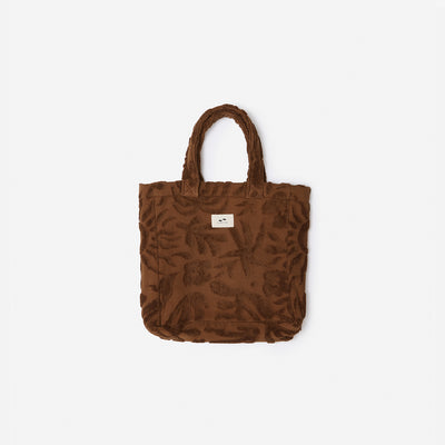Brown textured tote bag, cotton canvas lining, built-in pocket, small white label.
