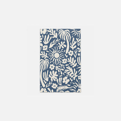 Mat made from recycled microfiber with blue and white floral and sun pattern.