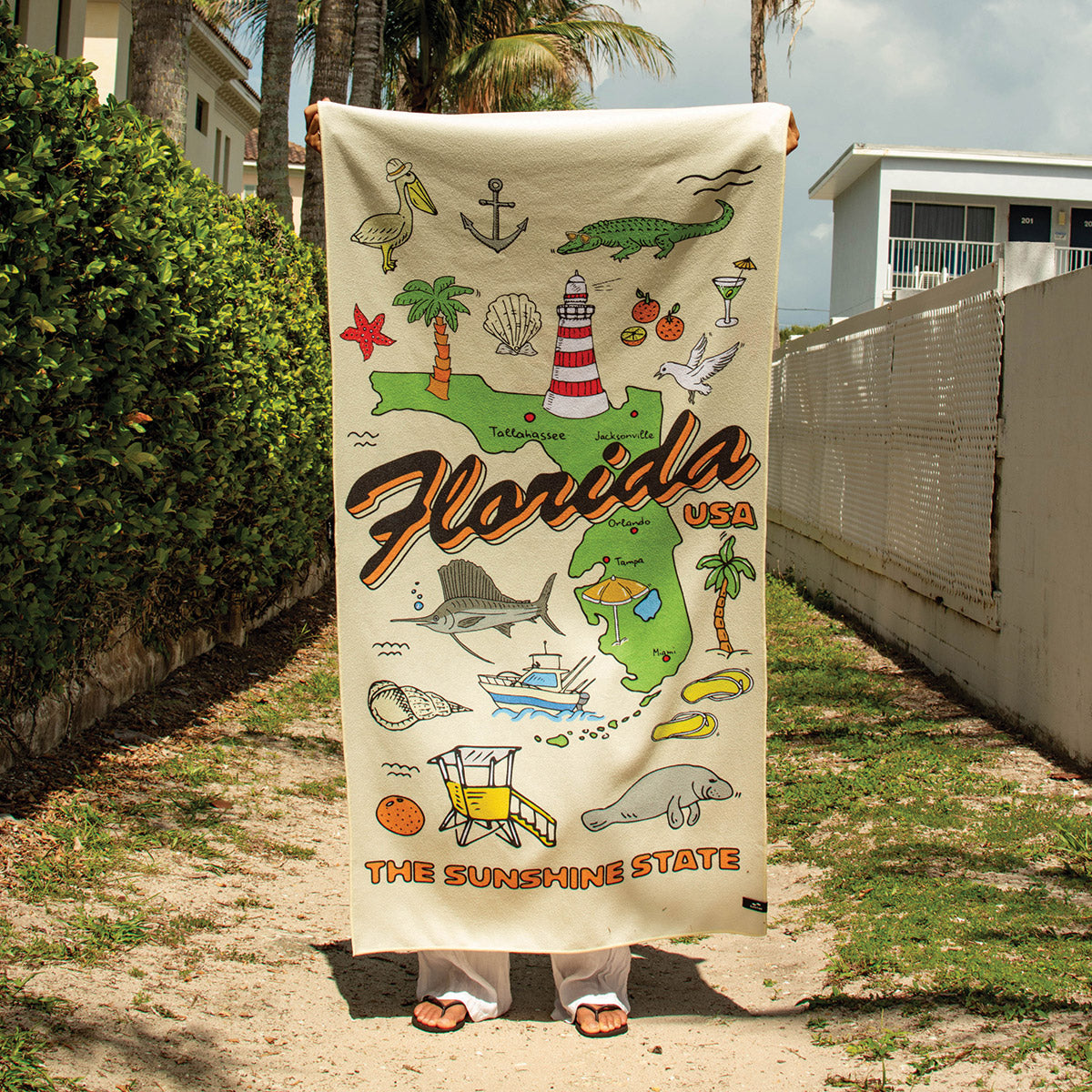 Beach towel, recycled material, Florida icons and The Sunshine State text.