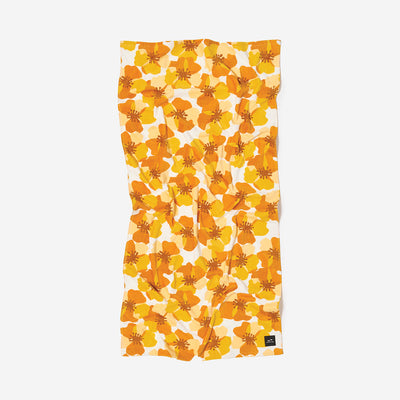 Velour towel with yellow and orange floral print, shown flat.