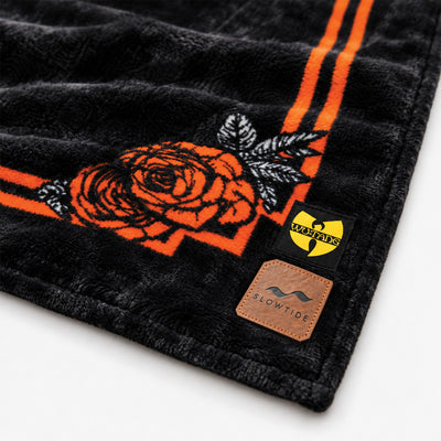 Polar fleece towel featuring an orange rose pattern and tiger logo patches.