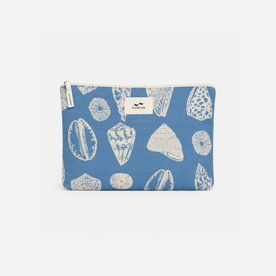 Cotton pouch with white seashell print, top zipper, and center label for travel essentials.