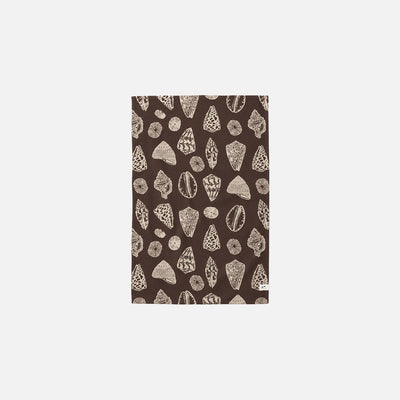 Rectangular brown microfiber mat with beige geometric and shell patterns.