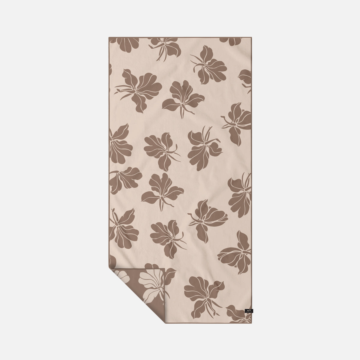 Microfiber travel towel with brown floral pattern for sand-free use.