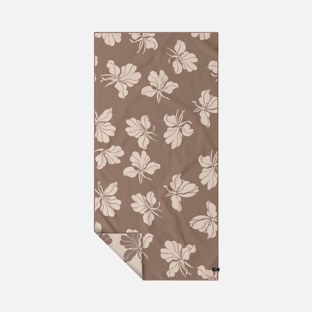Sand-free towel in a brown and cream floral pattern.