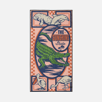 Microfiber towel with colorful alligator, manatee, dolphin, and Florida-themed design.